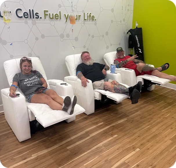 Three guests receiving IV drips in recliners at the Lee’s Summit clinic