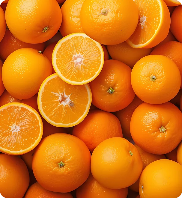 A close-up of whole and sliced oranges
