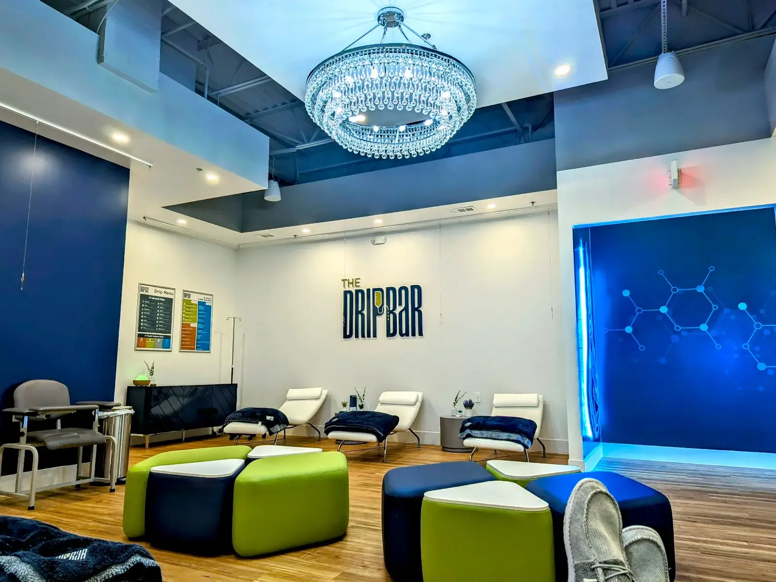 The DRIPBaR Lee’s Summit lobby, with lounge seating and a chandelier