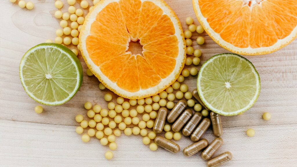 Citrus slices with vitamin C supplements and capsules
